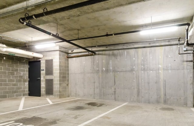 Secure underground garage parking with modern lighting