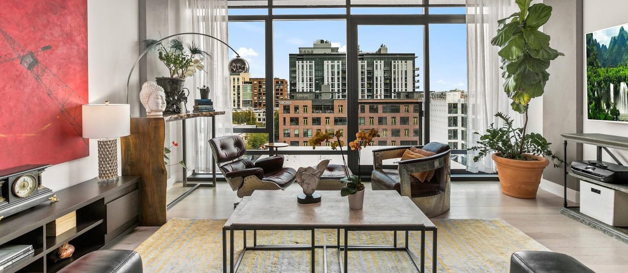 Modern loft interior with city skyline view and contemporary furnishings
